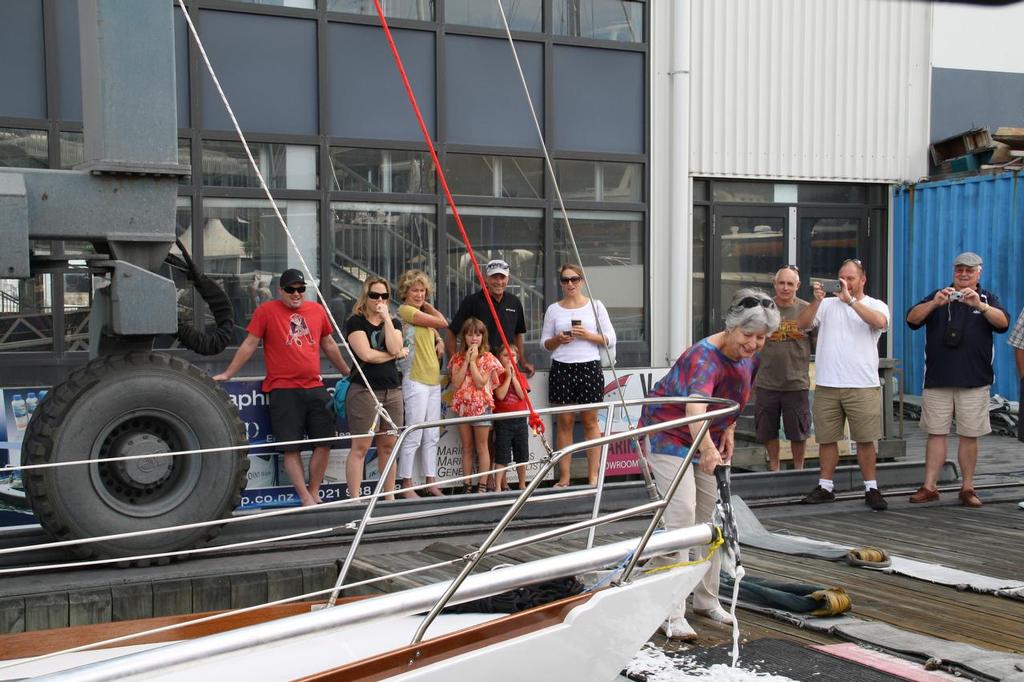 Lorraine Street breaks the Champagne on the spinnaker pole of Rainbow II  © Alan Sefton